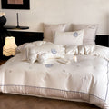 Luxurious cotton satin bedding set with embroidered butterfly appliqués and fine piping