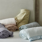 Light padded bedspread made of linen-cotton blend with gathered ruffle