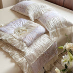 Satin bedding set with floral pattern and pleated ruffles