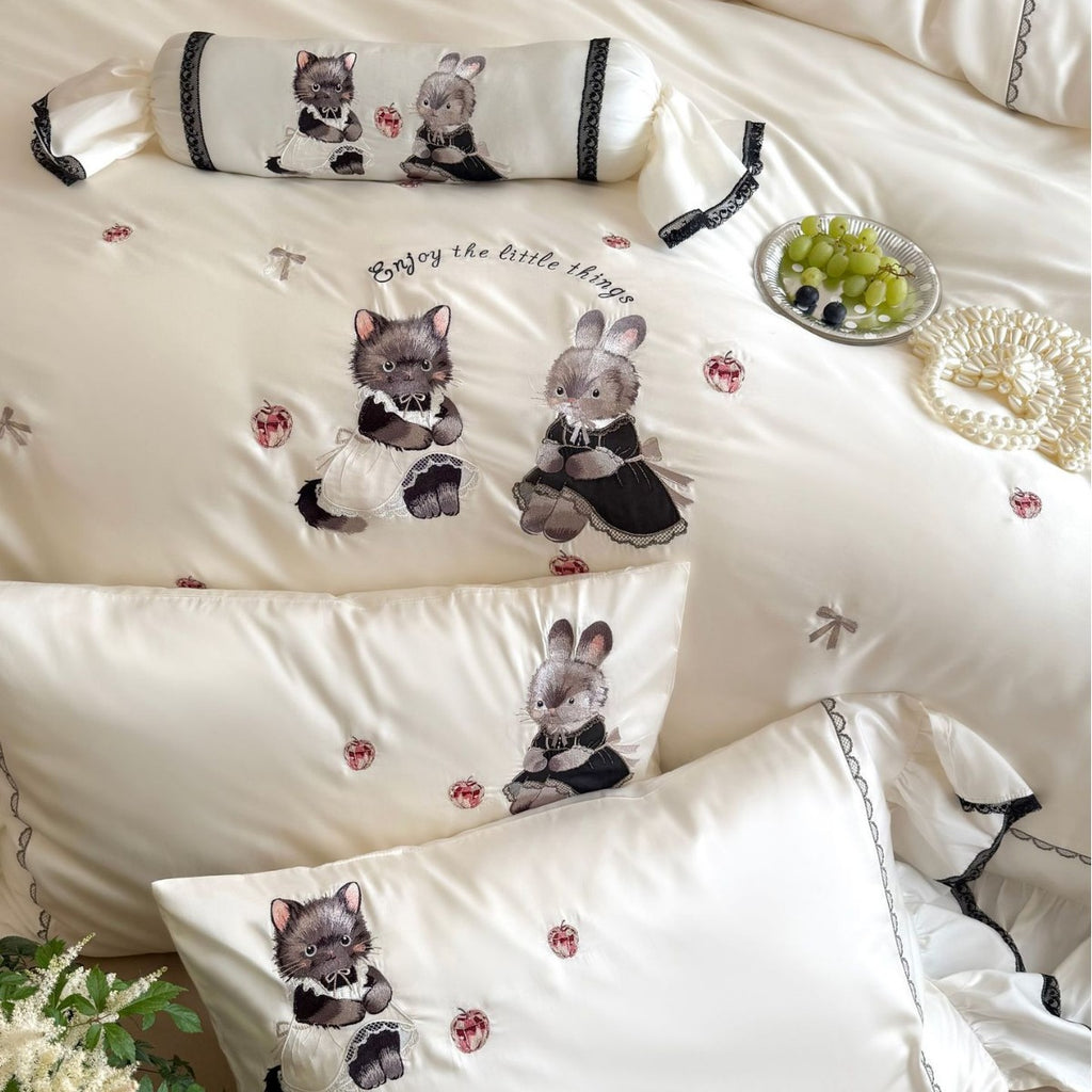 Embroidered satin bedding set with frill, ruffled hem, and animal motif