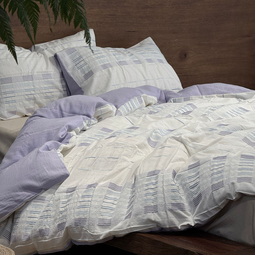 Cotton percale bedding set with a light quilted texture and subtle striped texture