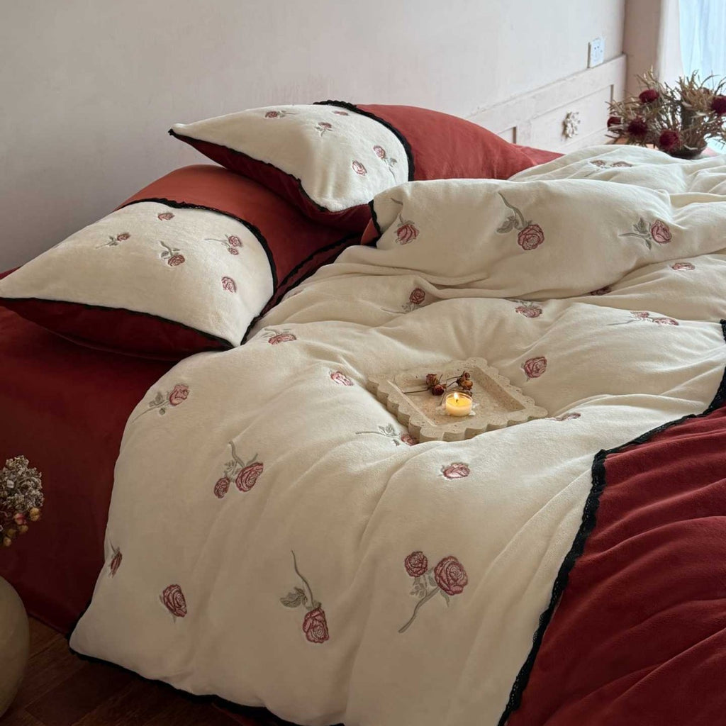 Embroidered bedding set with rose embroidery and contrasting piping