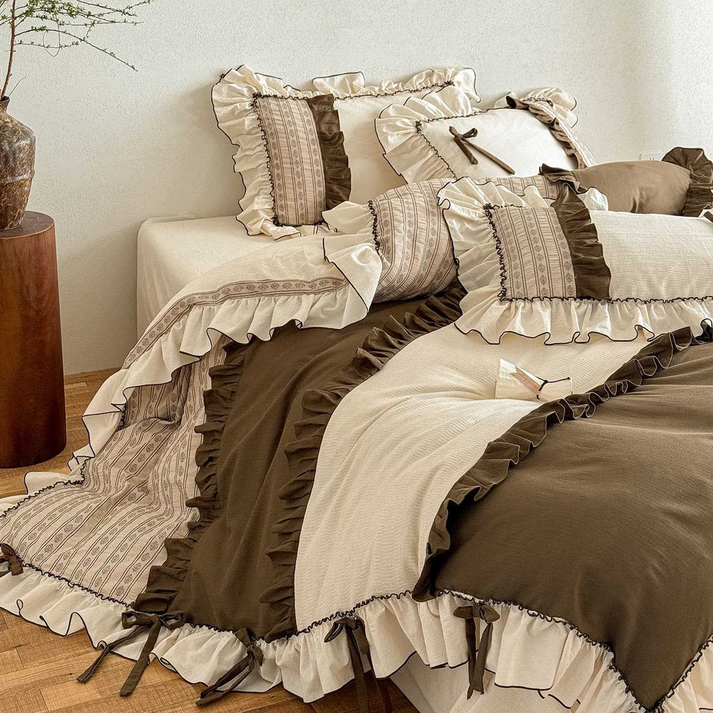Country house style cotton-linen bedding set with ruffles, striped bedspread and decorative pillow