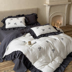 Reversible duvet cover in country house style with contrasting ruffle and fine branch embroidery