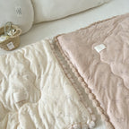 Cuddle blanket baby quilt with plush lining and bunny motif