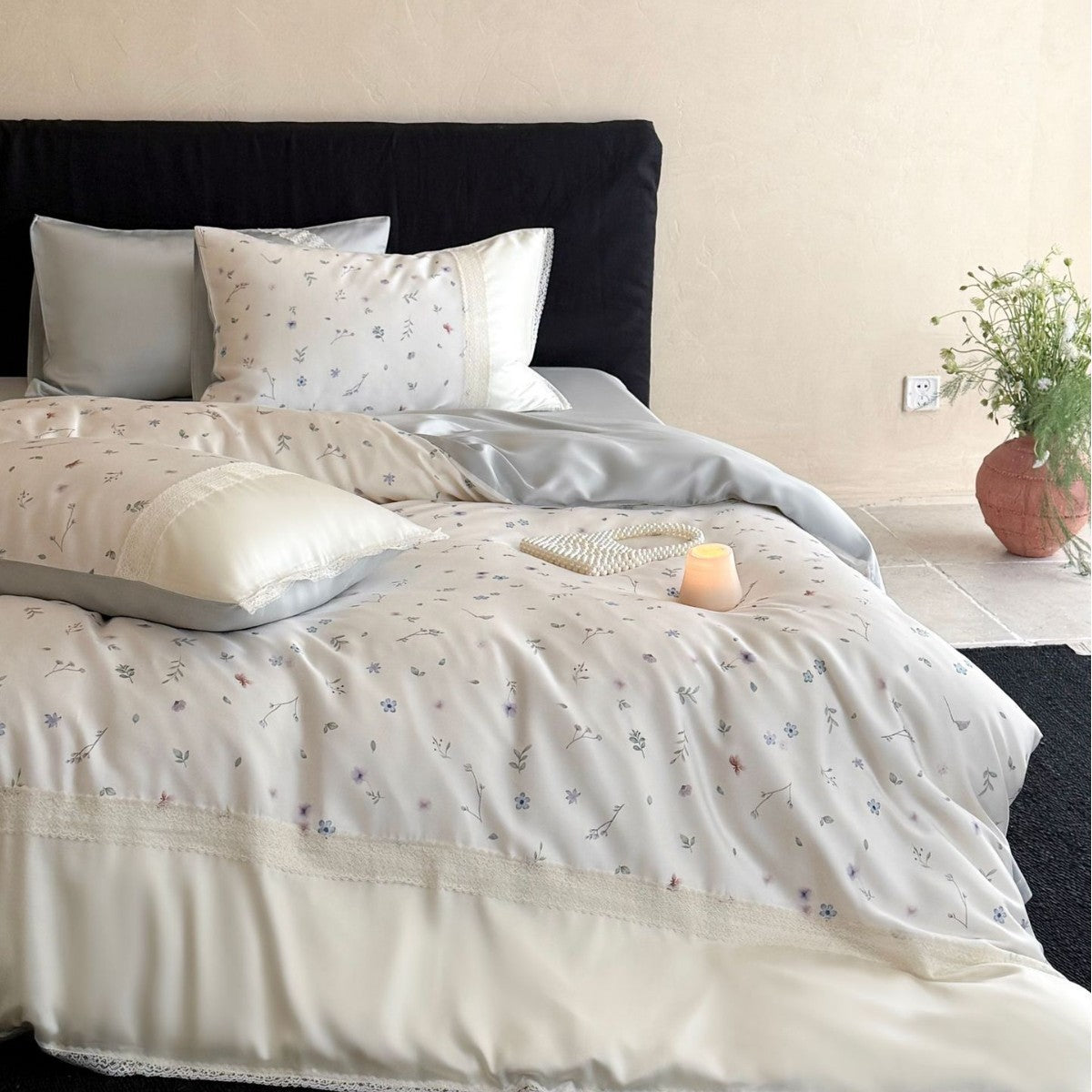Cotton satin bedding set with delicate floral embroidery and lace trim