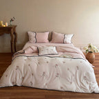 Embroidered bedding set with rose embroidery and contrasting piping