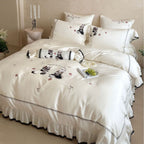 Embroidered satin bedding set with frill, ruffled hem, and animal motif