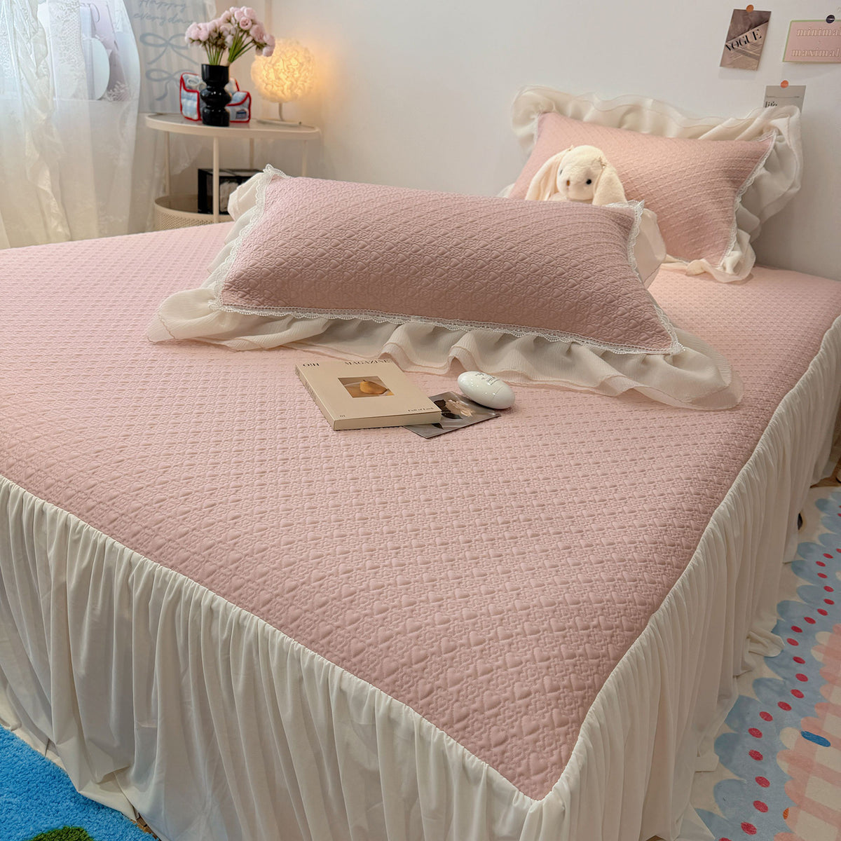 Quilted bedspread with ruffle and delicate floral quilting