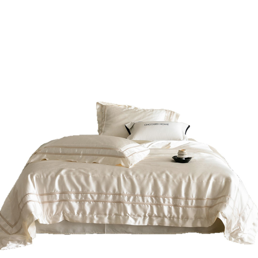 Luxurious satin bedding set with decorative borders and silky-smooth feel