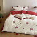 Embroidered cotton bedding set with rose appliqués and tassels