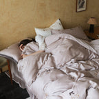 Bedding set made of premium satin with fine floral embroidery and piping edge