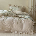 Duvet cover set made of cotton satin with watercolor magnolia print, ruffle, and tie ribbons