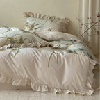 Duvet cover set made of cotton satin with watercolor magnolia print, ruffle, and tie ribbons