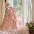 Romantic satin bedding and bedspread set with decorative ruffles and bows