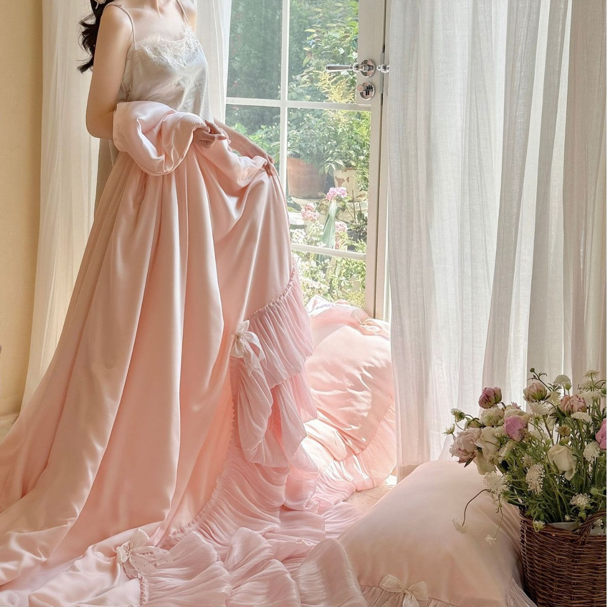 Romantic satin bedding and bedspread set with decorative ruffles and bows