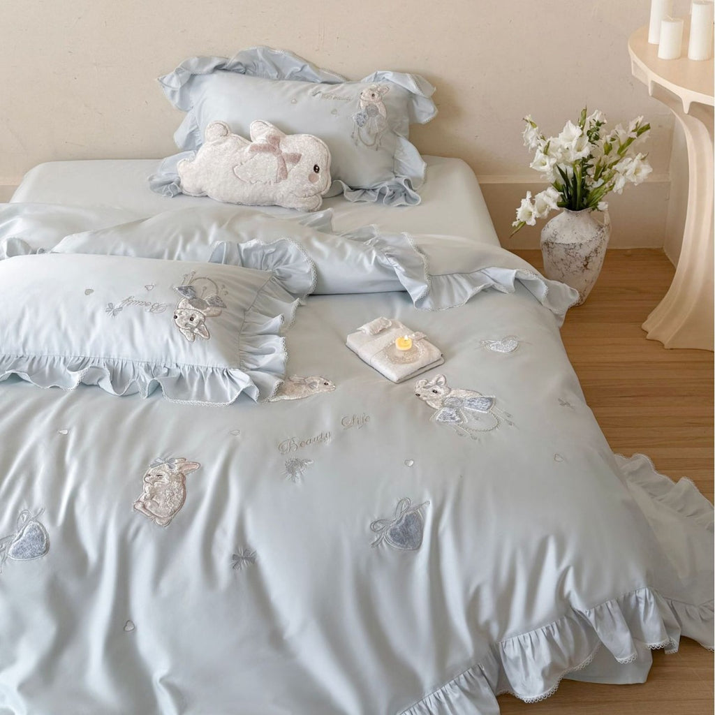 Satin bedding set with ruffles, embroidered bunny appliqués and silky-smooth finish
