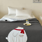 Reversible quilted bedspread with embroidered bear motif and light filling