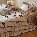 Romantic bedding set with ruffles, frills, and decorative bows