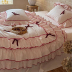 Romantic bedding set with ruffles, frills, and decorative bows