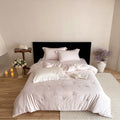 Luxurious embroidered cotton satin bedding set with delicate butterfly and flower appliqués