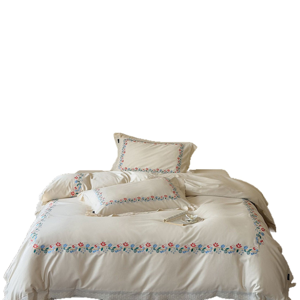 Embroidered cotton satin bed linen set with floral border and fine lace edge