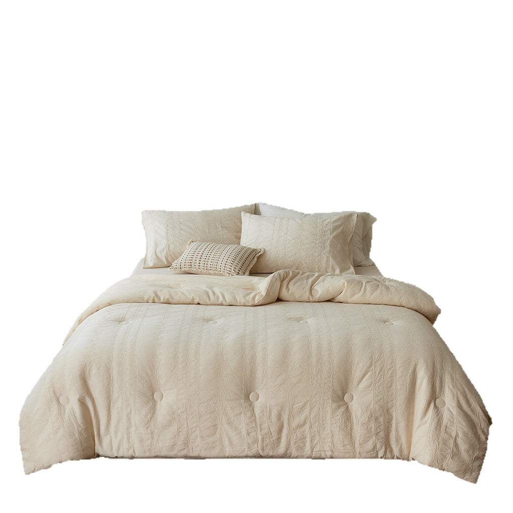 Quilted duvet cover made of linen-cotton mix with subtle textured embroidery and button tufting