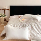 Luxurious embroidered cotton satin bedding set with delicate butterfly and flower appliqués