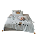 Children's bedding set with quilted cover and bear application