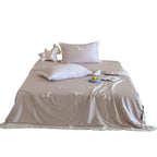 Satin bedding set with embroidered cat appliqués and silky soft finish