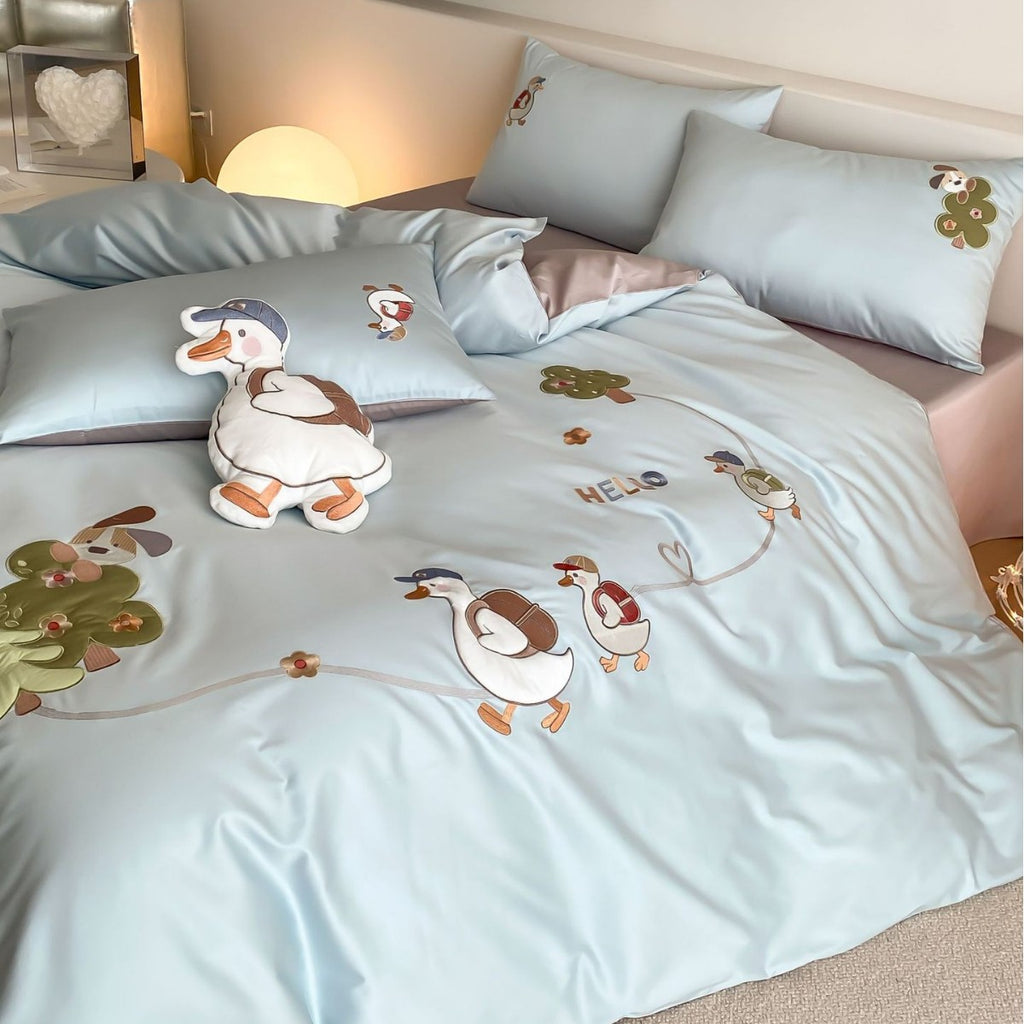 Reversible children's bedding set with cute goose appliqués and silky soft microfiber cover