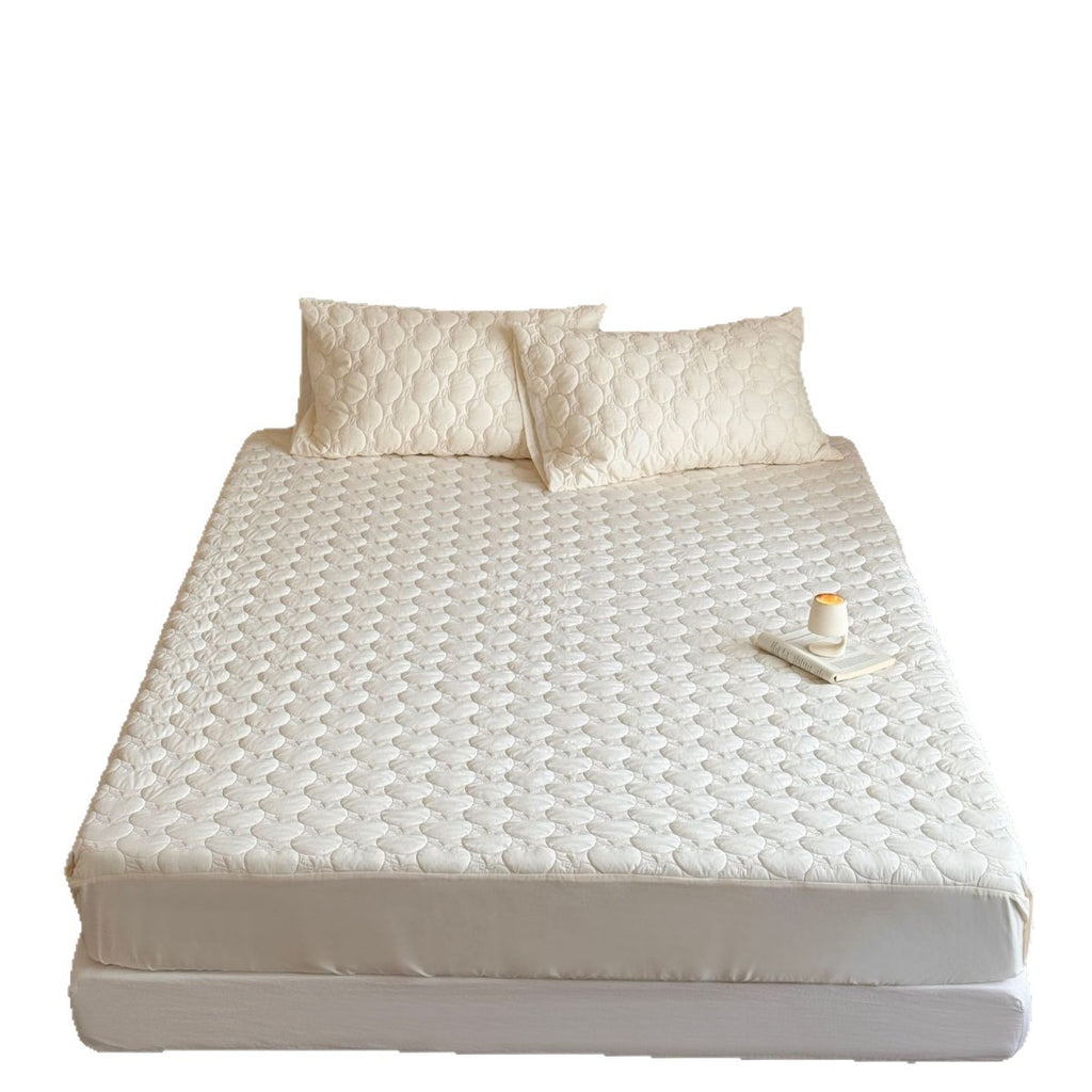 Padded mattress protector with quilted comfort layer and all-around elastic band