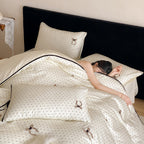Luxurious satin bedding set with delicate polka dots and bow embroidery
