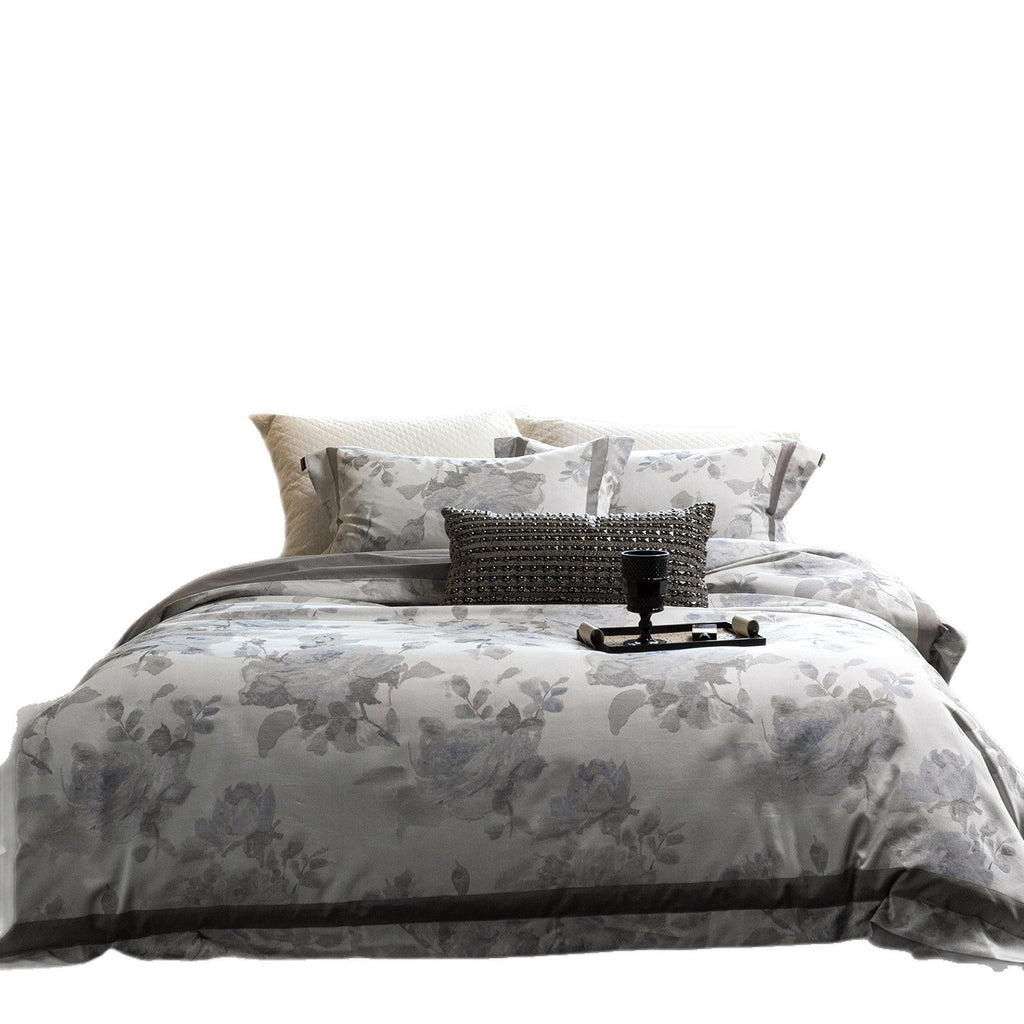 Cotton satin duvet cover set with delicate watercolor floral print, piped edge and matching pillowcases