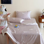 Satin bedding set with embroidered cat appliqués and silky soft finish