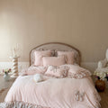 Romantic cotton bedding set with jacquard structure, ruffles and bow trim
