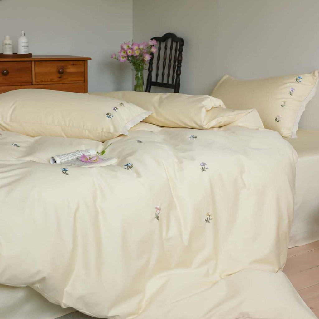 Embroidered cotton satin bedding set with subtle floral scatter design