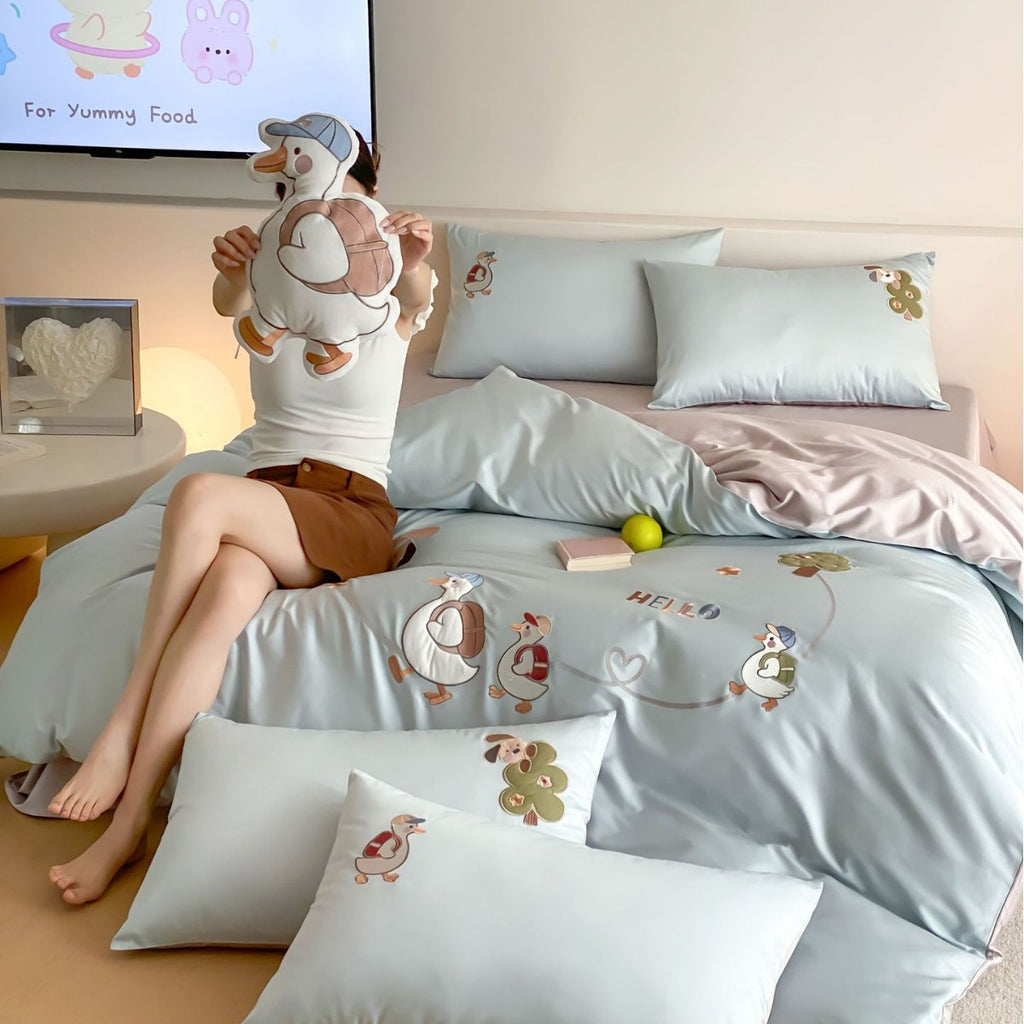 Reversible children's bedding set with cute goose appliqués and silky soft microfiber cover
