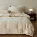 Quilted duvet cover made of linen-cotton mix with subtle textured embroidery and button tufting