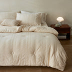 Quilted duvet cover made of linen-cotton mix with subtle textured embroidery and button tufting