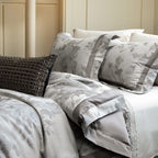 Cotton satin duvet cover set with delicate watercolor floral print, piped edge and matching pillowcases