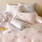 Satin bedding set with embroidered galaxy motif and silky smooth finish