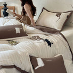 striped cotton bedding set with embroidered teddy bear appliqués and button closure