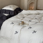 Reversible duvet cover in country house style with contrasting ruffle and fine branch embroidery