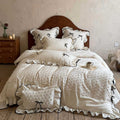 Romantic cotton-linen bed linen set with broderie anglaise, frills, and contrast piping