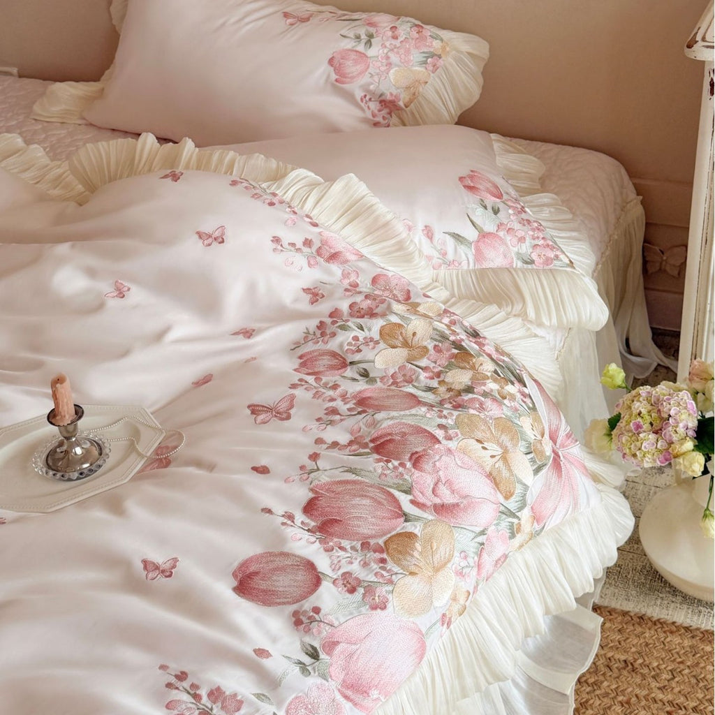 Luxurious embroidered satin bedding set with ruffles and floral details