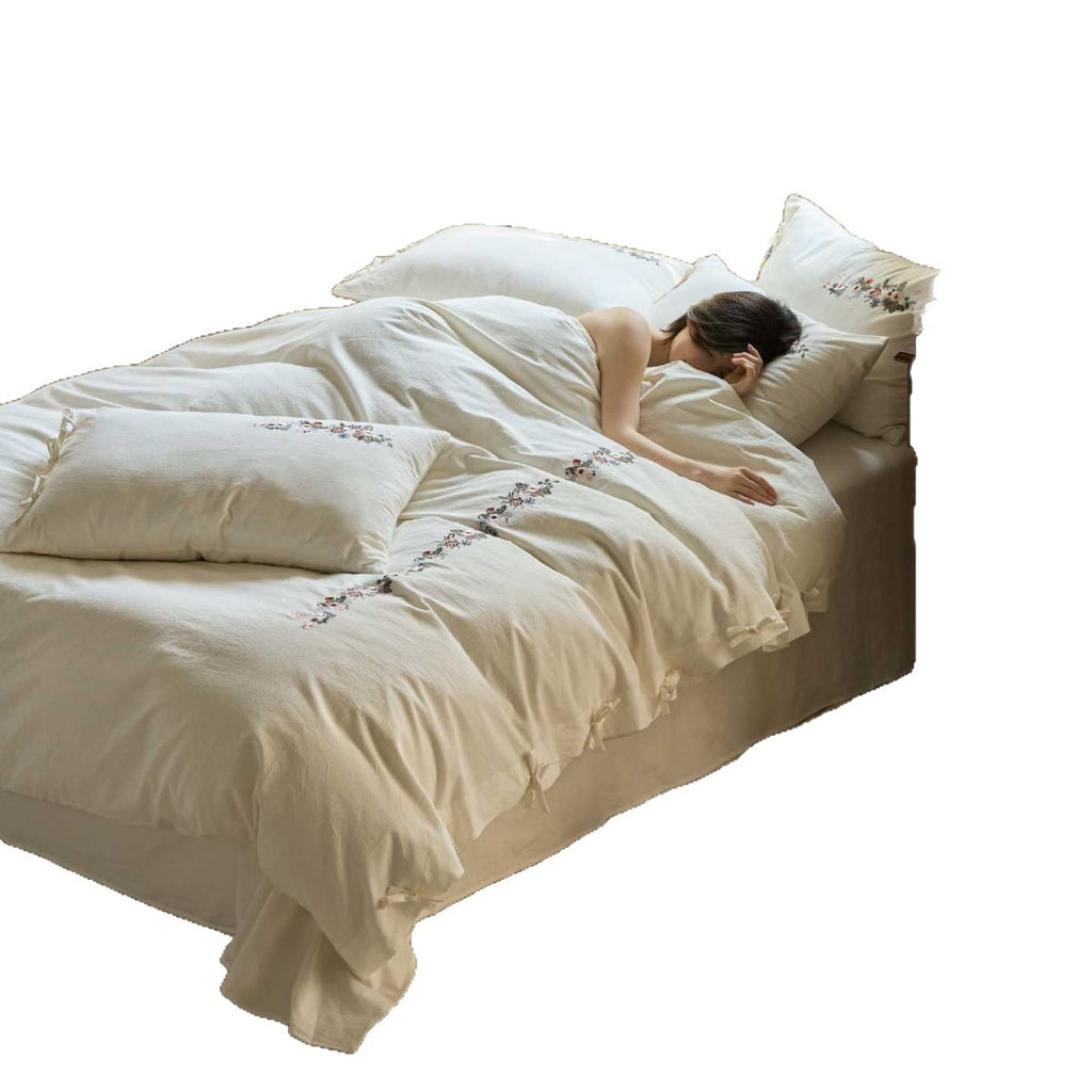Embroidered cotton bedding set with floral border design and extra-soft percale quality