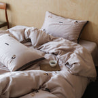 Bedding set made of premium satin with fine floral embroidery and piping edge