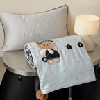 Children's bedding set with quilted cover and bear application