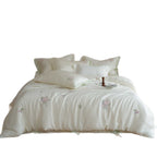 Embroidered cotton satin duvet cover with pillowcases and ties